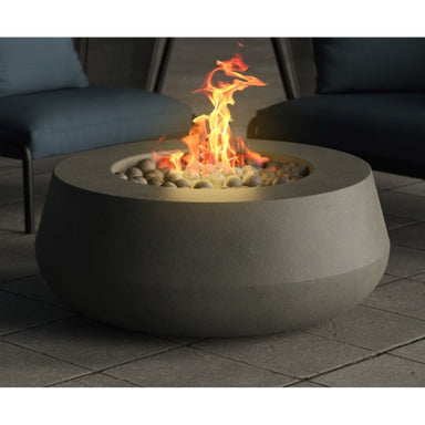 The Prism Hardscapes Oasis 42 Fire Bowl in Pewter finish is the centerpiece of a cozy outdoor patio